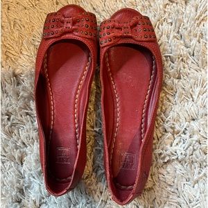 Red flats with studded bow